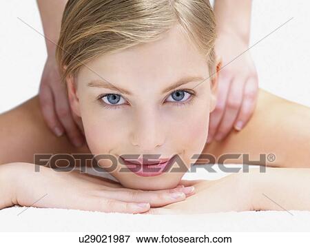 Young woman getting massage View Large Photo Image Stock Photo - Young woman getting massage. Fotosearch