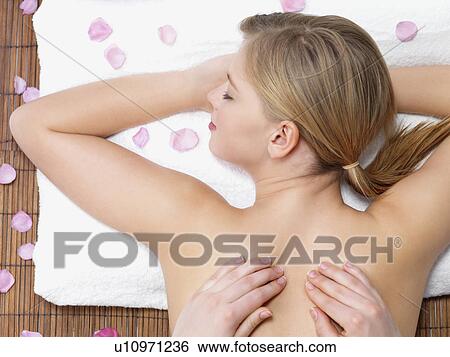 Stock Photograph - Young woman getting massage. Fotosearch