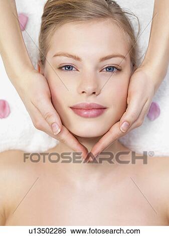 Young woman getting massage View Large Photo Image Stock Photograph - Young woman getting massage. Fotosearch