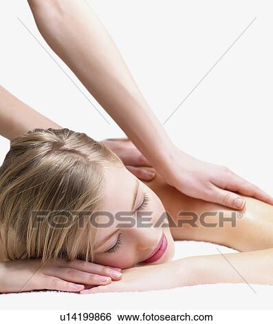 Stock Photograph - Young woman getting massage. Fotosearch