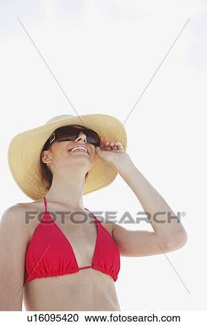 Young woman in bikini, protective hat and sunglasses View Large Photo Image Stock Image - Young woman in bikini, protective hat and sunglasses. Fotosearch