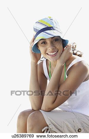 Young woman in sun hat at beach View Large Photo Image Stock Photo - Young woman in sun hat at beach. Fotosearch