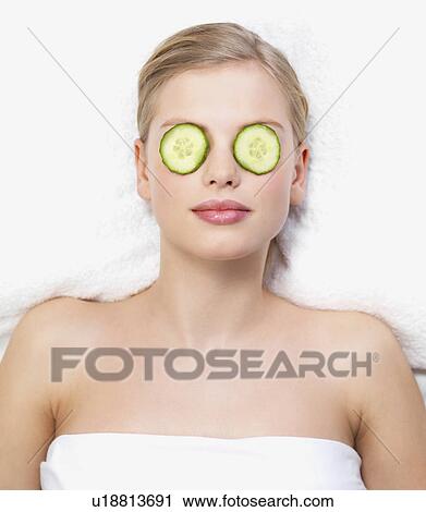 Young woman lying down in massage table View Large Photo Image Stock Image - Young woman lying down in massage table. Fotosearch