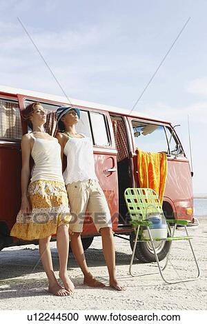 Young women leaning on van View Large Photo Image Stock Image - Young women leaning on van. Fotosearch