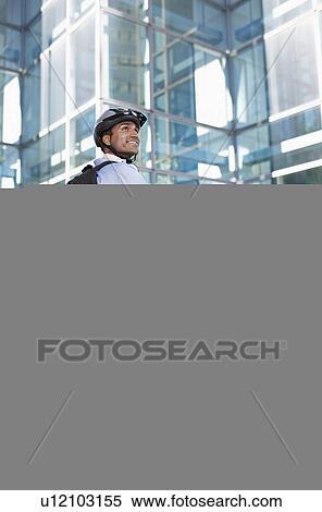 Stock Photography - Businessman on Folding Bike. Fotosearch