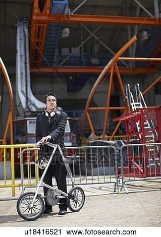 Businessman with Bicycle at Roosevelt Island Tramway View Large Photo Image Stock Image - Businessman with Bicycle at Roosevelt Island Tramway. Fotosearch