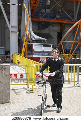 Businessman with Bicycle at Roosevelt Island Tramway View Large Photo Image Stock Photo - Businessman with Bicycle at Roosevelt Island Tramway. Fotosearch