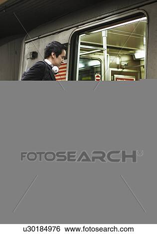 Businessman with Bicycle Boarding Subway Train View Large Photo Image Stock Photograph - Businessman with Bicycle Boarding Subway Train. Fotosearch
