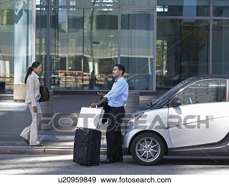 Businessman With Suitcase on Street View Large Photo Image Stock Photo - Businessman With Suitcase on Street. Fotosearch