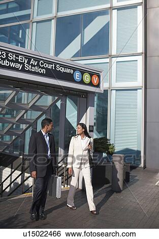 Stock Photograph - Businesswoman and Businessman at Subway Station. Fotosearch