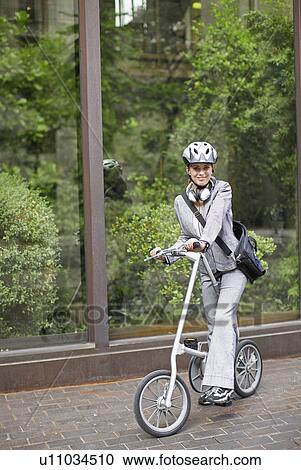 Businesswoman Commuting with Bicycle View Large Photo Image Stock Image - Businesswoman Commuting with Bicycle. Fotosearch