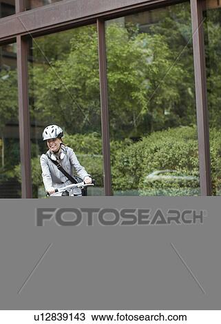 Businesswoman Cycling View Large Photo Image Stock Image - Businesswoman Cycling. Fotosearch
