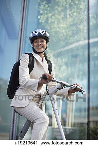 Businesswoman on Folding Bike View Large Photo Image Stock Image - Businesswoman on Folding Bike. Fotosearch