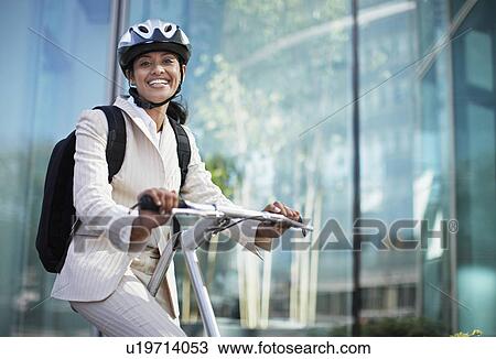 Businesswoman on Folding Bike View Large Photo Image Stock Image - Businesswoman on Folding Bike. Fotosearch
