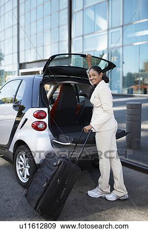 Businesswoman Unloading Smart Car View Large Photo Image Stock Photo - Businesswoman Unloading Smart Car. Fotosearch