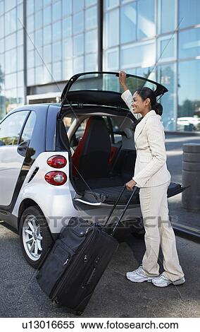 Businesswoman Unloading Smart Car View Large Photo Image Stock Photography - Businesswoman Unloading Smart Car. Fotosearch