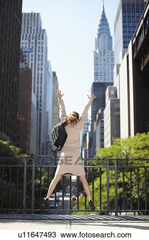 Businesswoman with Backpack Jumping View Large Photo Image Stock Image - Businesswoman with Backpack Jumping. Fotosearch