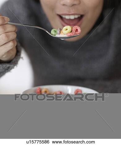 Close-Up of Mid-Adult Woman Eating Breakfast View Large Photo Image Stock Photograph - Close-Up of Mid-Adult Woman Eating Breakfast. Fotosearch