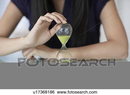 Close-Up of Mid-Adult Woman with Hourglass View Large Photo Image Stock Photograph - Close-Up of Mid-Adult Woman with Hourglass. Fotosearch