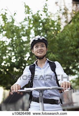 Low Angle View of Woman Cycling View Large Photo Image Stock Photo - Low Angle View of Woman Cycling. Fotosearch