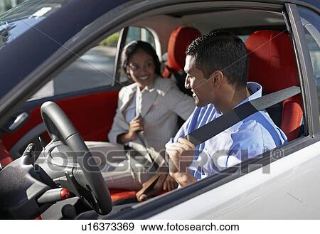 Mid-Adult Couple Attaching Seat Belts in Car View Large Photo Image Stock Photo - Mid-Adult Couple Attaching Seat Belts in Car. Fotosearch