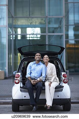 Mid-Adult Couple Sitting in Car Trunk View Large Photo Image Stock Photo - Mid-Adult Couple Sitting in Car Trunk. Fotosearch
