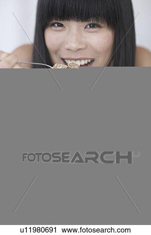 Mid-Adult Woman Eating Breakfast Cereals View Large Photo Image Stock Image - Mid-Adult Woman Eating Breakfast Cereals. Fotosearch
