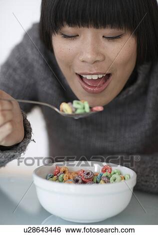 Mid-Adult Woman Eating Breakfast Cereals View Large Photo Image Stock Photograph - Mid-Adult Woman Eating Breakfast Cereals. Fotosearch
