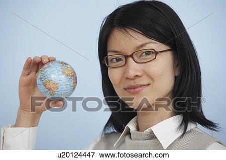 Mid-Adult Woman Holding Globe View Large Photo Image Stock Photo - Mid-Adult Woman Holding Globe. Fotosearch