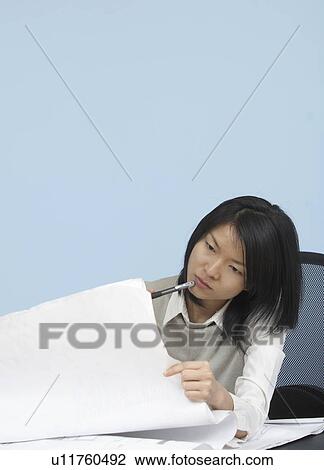 Mid-Adult Woman Looking at Blueprint View Large Photo Image Stock Image - Mid-Adult Woman Looking at Blueprint. Fotosearch