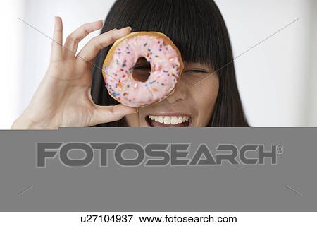 Mid-Adult Woman Looking Through Donut View Large Photo Image Stock Photo - Mid-Adult Woman Looking Through Donut. Fotosearch