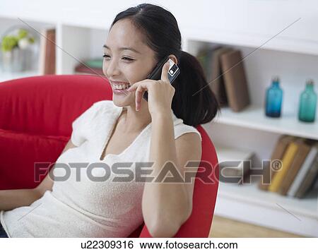 Stock Photograph - Mid Adult Woman on Cell Phone. Fotosearch
