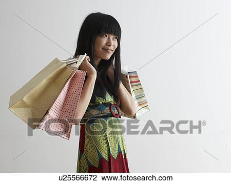 Mid Adult Woman with Shopping Bags View Large Photo Image Stock Image - Mid Adult Woman with Shopping Bags. Fotosearch