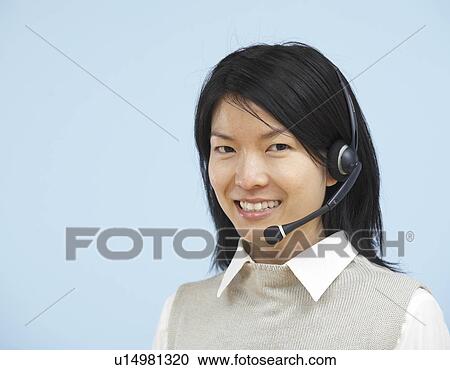 Stock Image - Portrait of Telephone Operator. Fotosearch
