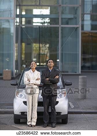 Two Businesspeople Beside Smart Car View Large Photo Image Stock Image - Two Businesspeople Beside Smart Car. Fotosearch
