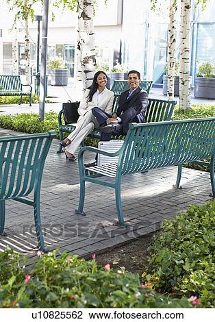 Two Businesspeople on Park Bench View Large Photo Image Stock Image - Two Businesspeople on Park Bench. Fotosearch