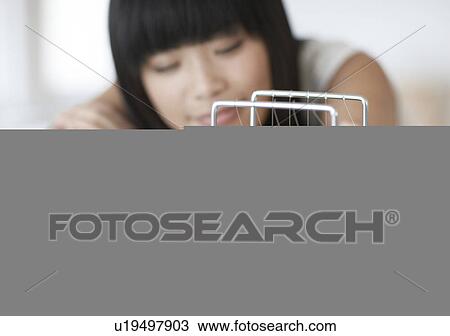 Woman Looking at Newton's Cradle View Large Photo Image Stock Image - Woman Looking at Newton's Cradle. Fotosearch