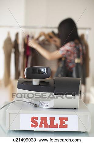 Woman Shopping Clothes in Sales View Large Photo Image Stock Image - Woman Shopping Clothes in Sales . Fotosearch