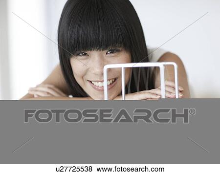 Woman with Newton's Cradle View Large Photo Image Stock Photo - Woman with Newton's Cradle. Fotosearch