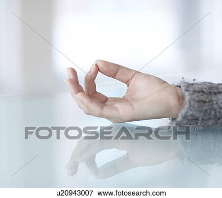 Stock Photo - Woman's Hand in Lotus Position. Fotosearch