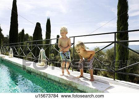 Picture - 2 boys at pool. Fotosearch