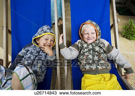 Stock Image - 2 boys laughing. Fotosearch