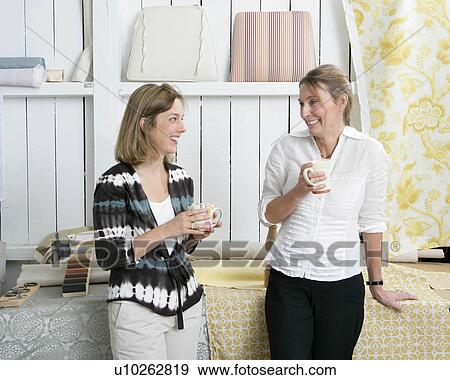 2 women discussing project View Large Photo Image Stock Photo - 2 women discussing project. Fotosearch