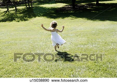 3 years old girl running in a field View Large Photo Image Stock Image - 3 years old girl running in a field. Fotosearch
