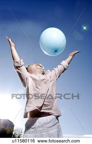 3 years old girl throwing a balloon View Large Photo Image Stock Photograph - 3 years old girl throwing a balloon. Fotosearch