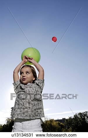 5 years old girl holding a balloon View Large Photo Image Stock Image - 5 years old girl holding a balloon. Fotosearch