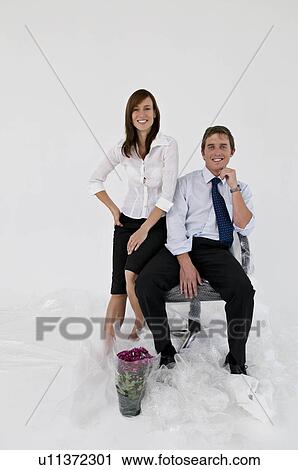 A business couple in a new office. View Large Photo Image Stock Image - A business couple in a new office.. Fotosearch