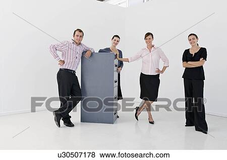 Stock Photo - A business group with filing cabinet. Fotosearch