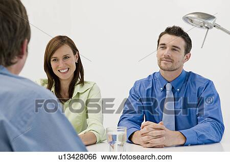 A business meeting View Large Photo Image Stock Photograph - A business meeting. Fotosearch