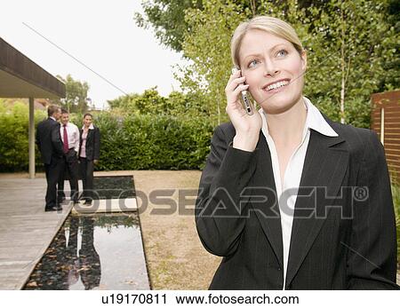 A business woman on her mobile phone. View Large Photo Image Stock Image - A business woman on her mobile phone.. Fotosearch
